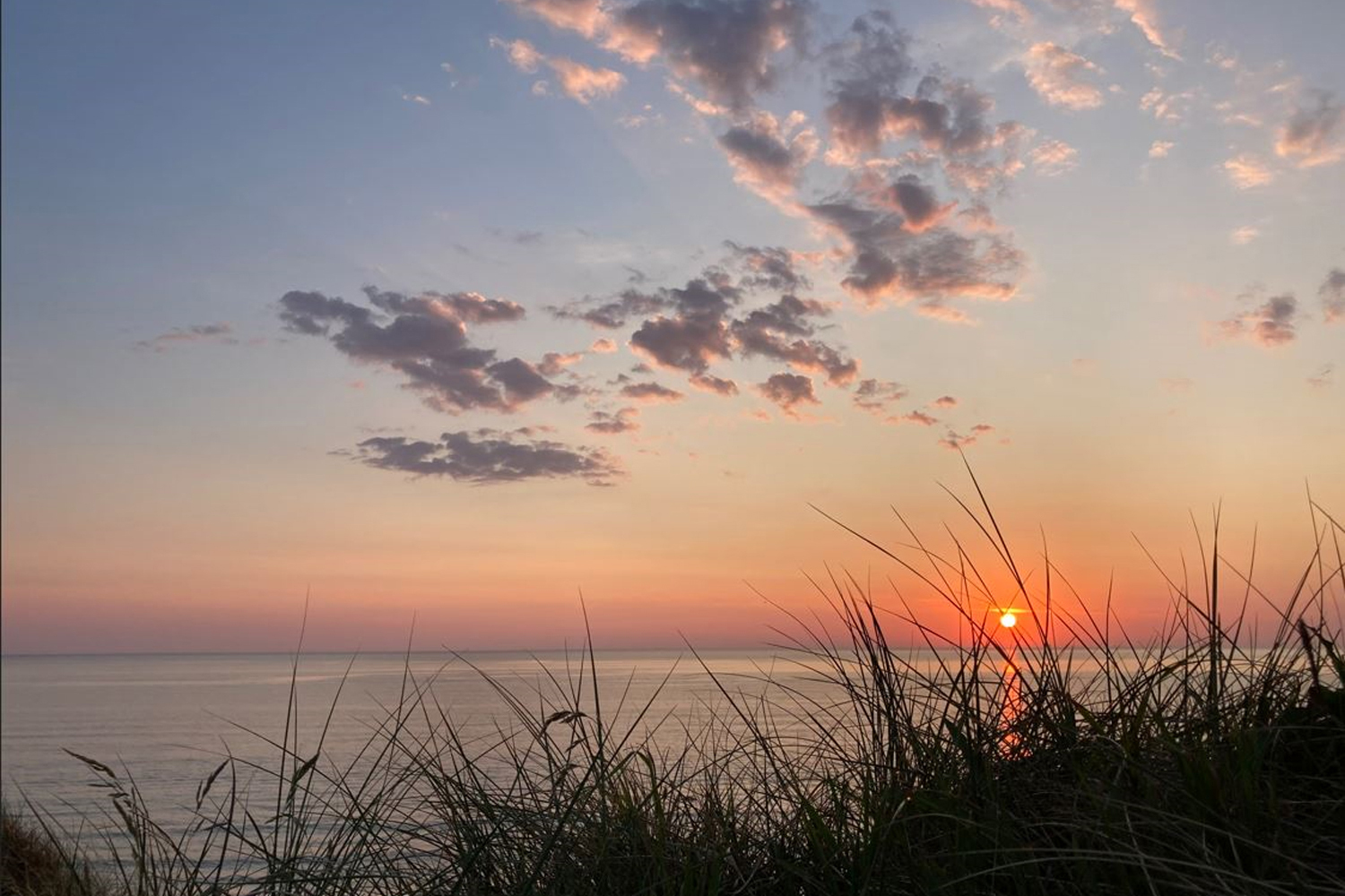 Sonnenuntergang
                                 von der Küste aus fotografiert beim Camping Lokken in Dänemark.